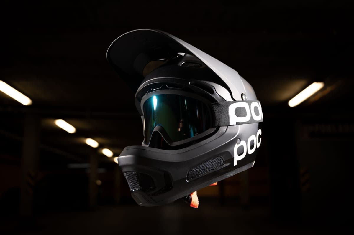 A full-face motorcycle helmet on a dark textured surface